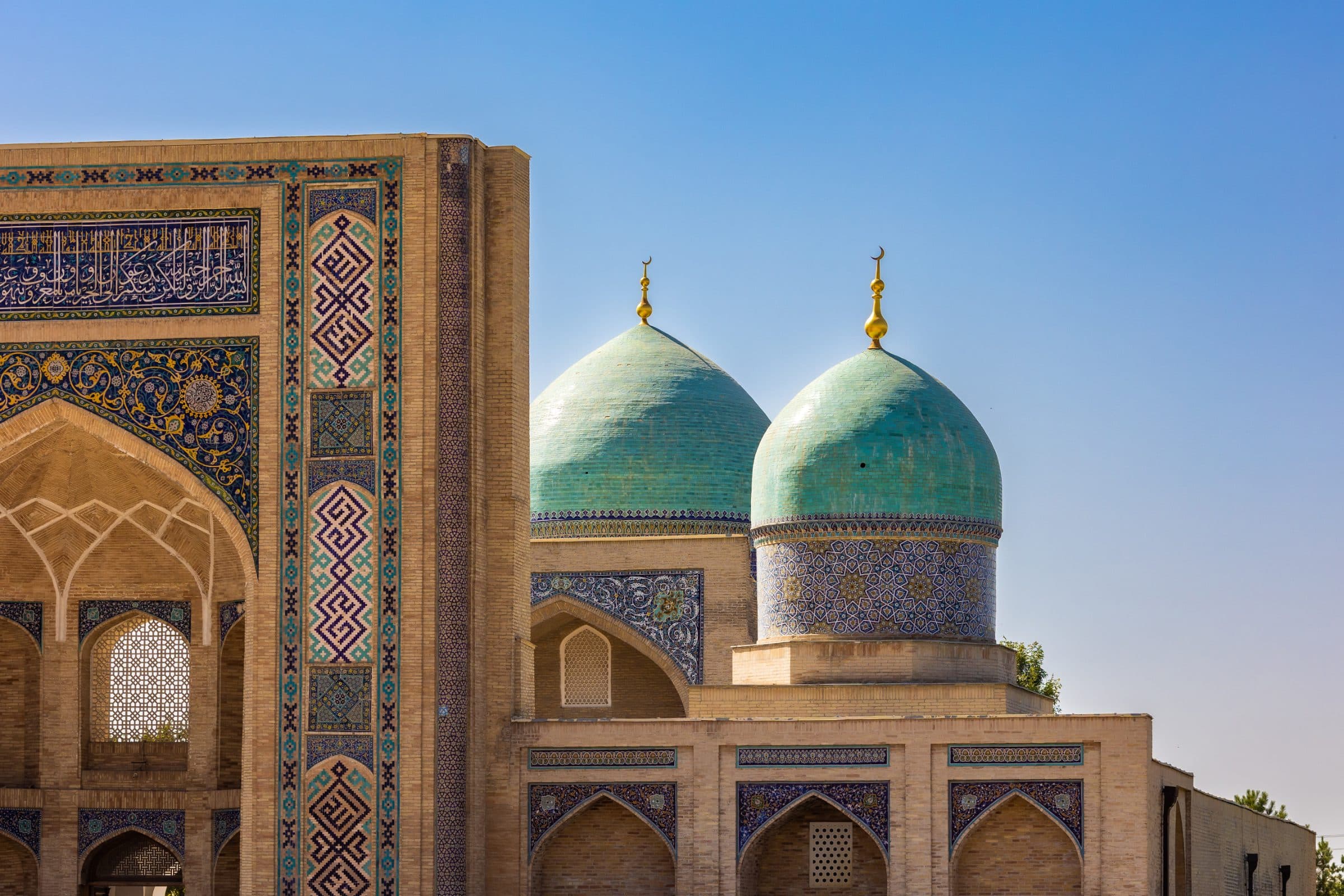 The green domes and tiled portal of the Hazrati Imam complex in Tashkent.